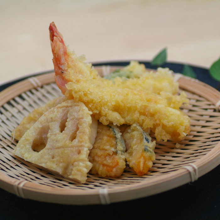 A tempura platter on a wooden plate