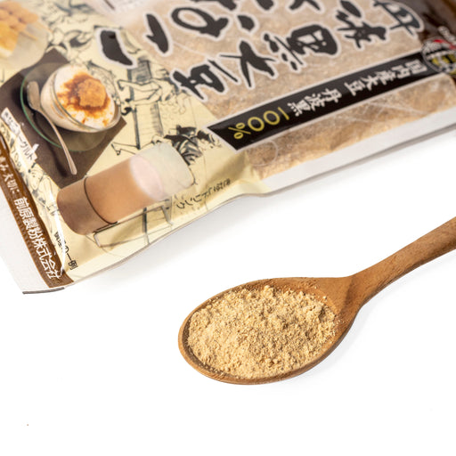 A spoon of kinako powder next to package of the product