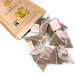 Tea bags popping out of a package bag of the product