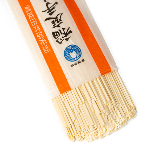 Dried udon noodles popping out of package