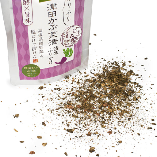 Scattered furikake next to a package bag of the product