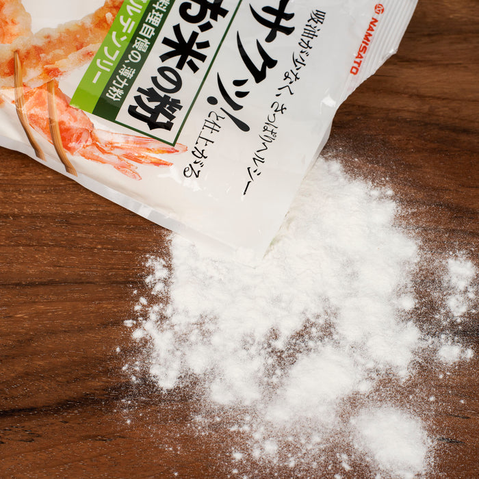 Scattered rice flour on cutting board