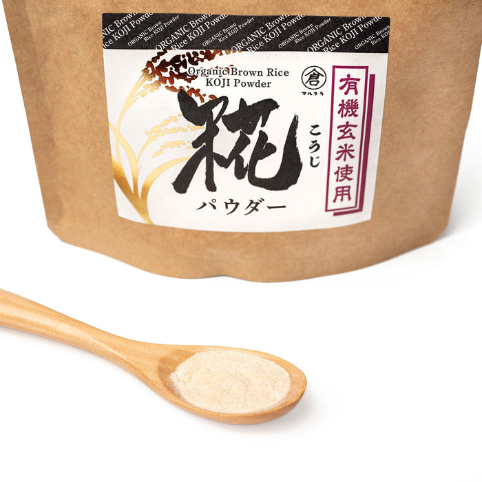 A spoon of organic brown rice koji  powder next to package of the product