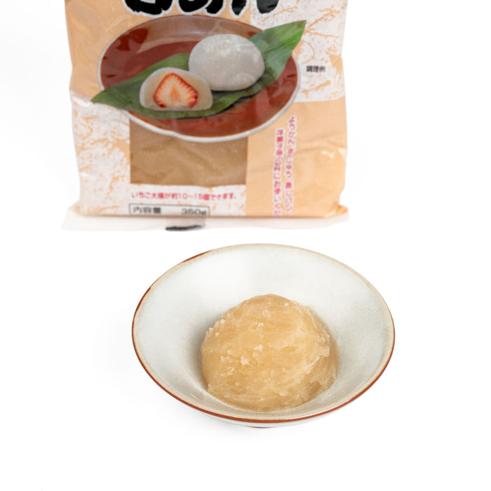 A bowl of shiroan next to package of the product