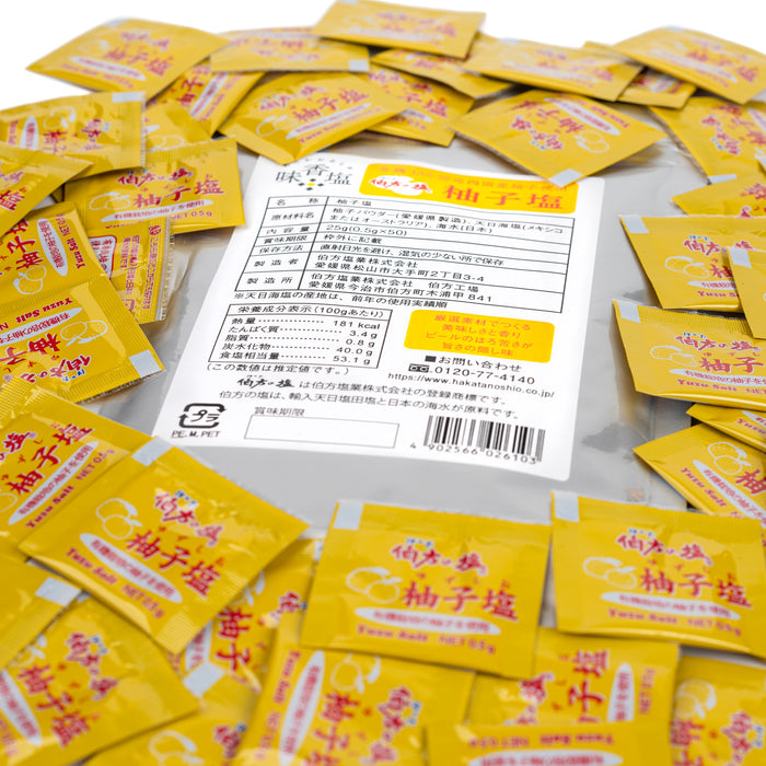 50 sachets of yuzu salt surrounding a package of the product