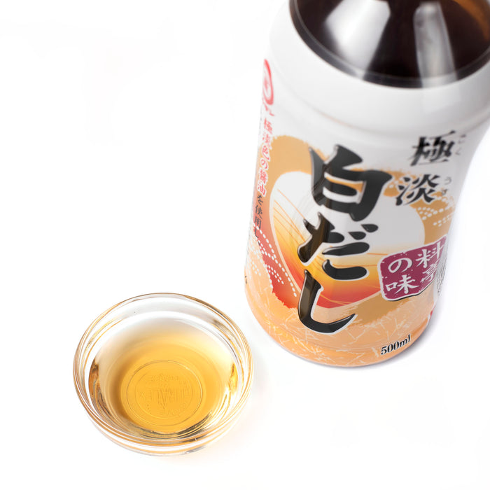 A small bowl of shiro dashi next to bottle of the product