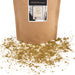 Scattered hojicha powder next to a bag of the product