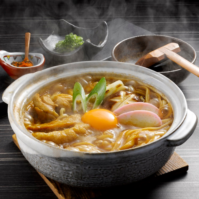 A kishimen noodles hot pot with miso soup and garnish