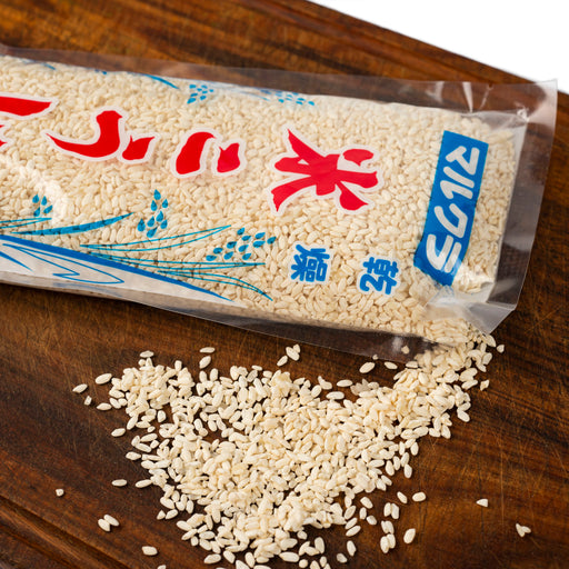 Scattered dried rice koji popping out of package of the product