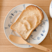 A plate of bread topped with shiroan