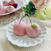 A plate of two cherry mochi