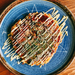 A plate of okonomiyaki pancake