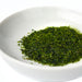 A bowl of nori seaweed flakes
