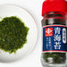 Overhead shot of a small bowl of nori seaweed flakes and a bottle of the product