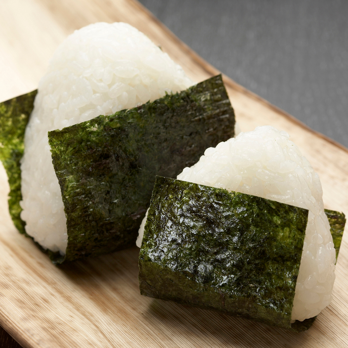 Two rice balls wrapped with nori seaweed