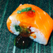 A salmon wrapped sushi roll