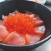 A sashimi rice bowl topped with salmon roe