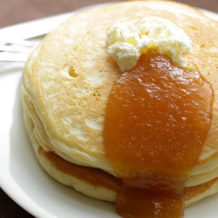 Pancakes topped with butter and organic yuzu spread