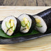 A plate of sushi rolls wrapped with roasted nori sheet