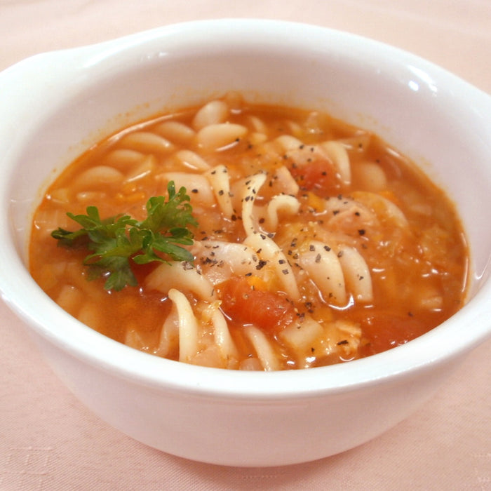A bowl of minestrone soup with fusilli