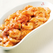 A plate of shrimps with tomato sauce and ichimi pepper