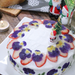 A whole Christmas cake decorated with dried edible flowers