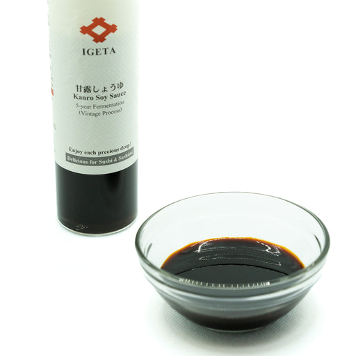 A bowl of Kanro Soy Sauce next to a bottle of the product